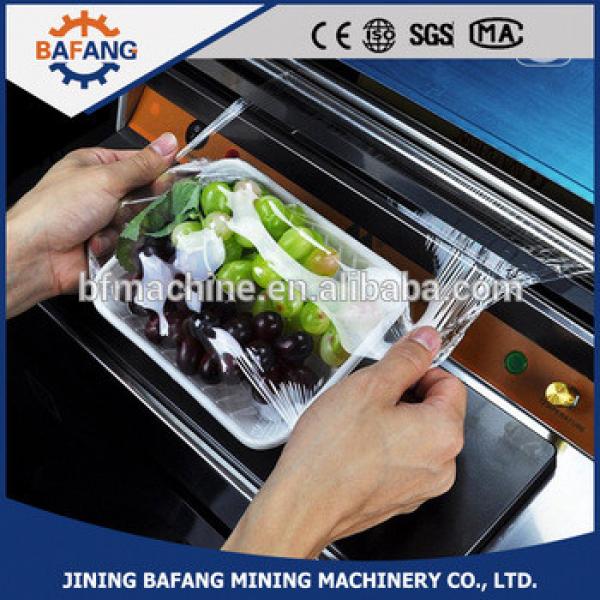 Efficient pvc cling film packing machine food tray film sealing machine #1 image