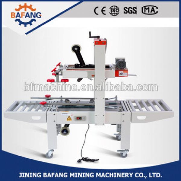 FXJ-6050 top &amp; bottom drive automatic strapping machine #1 image