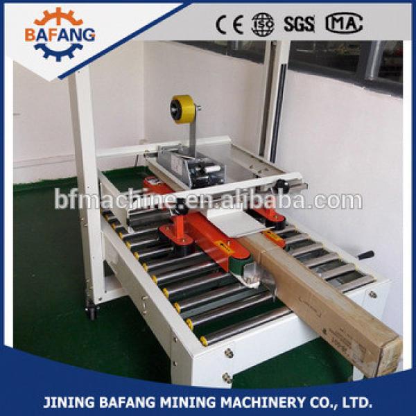 Semi-auto boxes sealing strapping machine #1 image